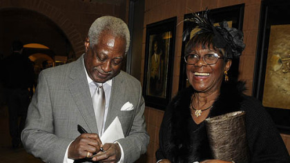 Roger Humphries signs an autograph for Jackie Walker.