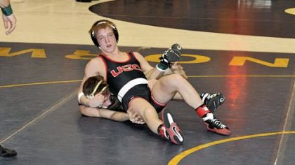 Upper St. Clair's Mackenzie McGuire, top, was a 2-1 winner against Greensburg Salem's Tyler Reinhart in the semifinals of the WPIAL/Southwest Region Class AAA tournament Saturday at Norwin High School. McGuire won the 132-pound title later that day, defeating Franklin Regional's Josh Shields in the final.