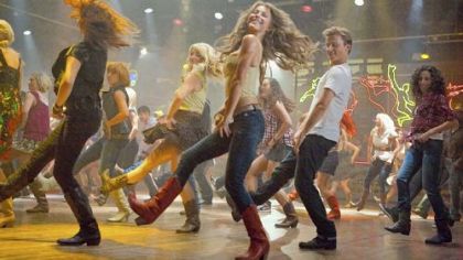Julianne Hough, center, and Kenny Wormald lead the way in "Footloose."