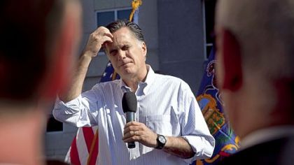Republican presidential candidate Mitt Romney pauses Thursday while speaking on the roof of an office building overlooking his campaign headquarters in Harrisburg.