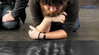 Matt Pritchard of South Homewood looks at Station 6 of the Cross during the Open Door's seventh annual Stations of the Cross show in East Liberty.