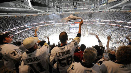 Fans celebrate a Penguin's goal in the first period  against Philly.