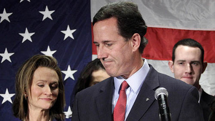 Former Sen. Rick Santorum turns to his wife Karen, left, after announcing he is suspending his candidacy for the presidency.