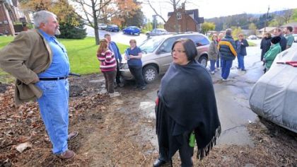Bridgeville Councilman Joe Colosimo, left, and his wife, Deb, stand at the end of Main Street with others who do not want the street used to access a planned housing development in Upper St. Clair.