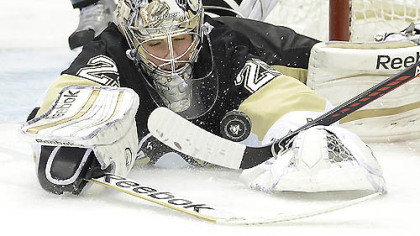 Goalie Marc-Andre Fleury makes a save in the second period of Game 2 last night at Consol Energy Center. Fleury was under siege again as the Penguins lost, 8-5.
