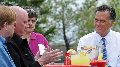 Jason Thomas (middle, left) speaks with Mitt Romney at the Bethel Park Community Center.