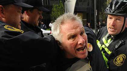 Timothy Lynn of Spring Garden, yells as he is  taken into custody  at EQT Plaza.