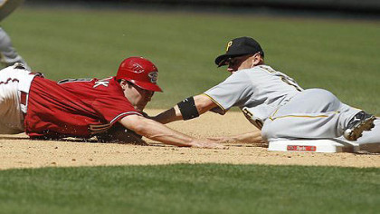 Pirates' Clint Barmes tags Arizona Diamondbacks' A.J. Pollock who slid past second base on a steal-attempt during the seventh inning.