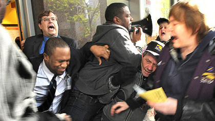Protesters are pushed from entering the Au Bon Pain cafe at the EQT Plaza, Downtown.