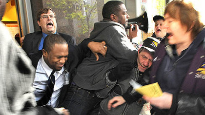 Protesters are pushed from entering the Au Bon Pain cafe at the EQT Plaza, Downtown.