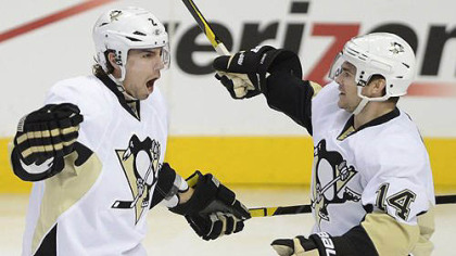 Penguins' Matt Niskanen and Chris Kunitz celebrate what looked like Niskanen's second goal of the game against the Flyers. The goal was later credited to Sidney Crosby (not pictured).