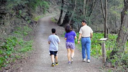 Walkers stroll Monday along the William Funk Bikeway in Duff Park in Murrysville. The town's trail committee wants more of such trails to link homes to parks and nature conservancies.