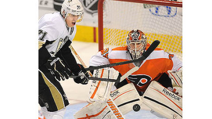 Evgeni Malkin eyes up the rebound against Flyers goalie Sergei Bobrovsky.