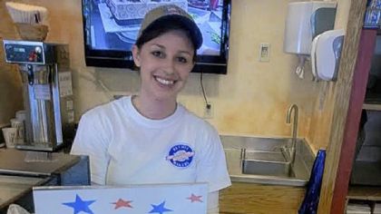 Bethel Bakery sales and marketing assistant Julie Lytle displays the store's CookieGate" special.