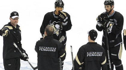 Penguins head coach Dan Bylsma (left) calls a drill during the team's practice for tonight's Game 5.