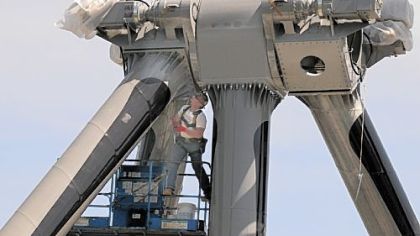 Walt Banachoski, a "setter" from Evan City, works on the new Black Widow ride at Kennywood. The ride is set to open May 17.