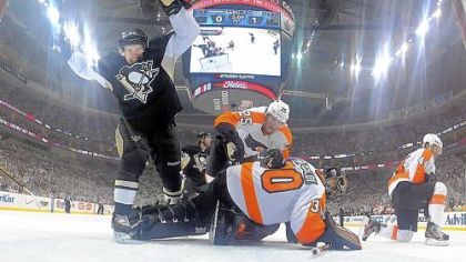 Sidney Crosby watches a puck shot by teammate Steve Sullivan head into the Philadelphia Flyers net in the first period of Game 5 of the team's first-round Stanley Cup playoff series at Consol Energy Center.
