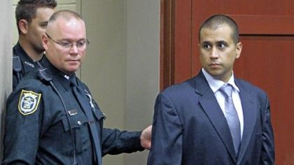 George Zimmerman, right, enters a courtroom in Sanford, Fla., on Friday for a bond hearing. Circuit Judge Kenneth Lester says Mr. Zimmerman can be released on $150,000 bail as he awaits trial for the shooting death of Trayvon Martin, 17. The 28-year-old Zimmerman is charged with second-degree murder in the shooting of Trayvon. He claims self-defense.