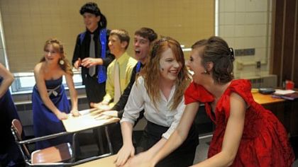 Lisa Lujetic, second from right, and Jamie Coulson, right, get pumped before Elizabeth Forward High School's performance of "The Wedding Singer" on Friday.