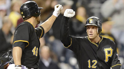 Clint Barmes, right, capped a 3-for-3 performance at the plate with a home run to tie the score, 4-4, in the eighth.