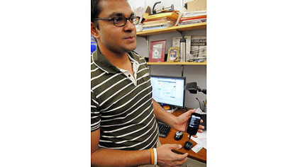 Balajee Kannan of Carnegie Mellon University shows an early protoype of a smartphone application that helps guide people in various environments. Researchers are looking into how to help visually-impaired people evcuate a building in an ermegency.