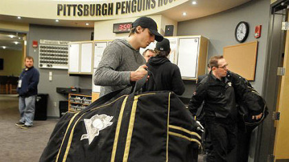 Goalie Marc-Andre Fleury packs his equipment in the Penguins locker room on Tuesday afternoon.