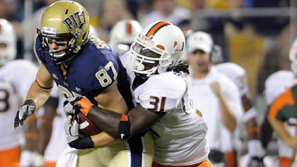 Pitt's Mike Shanahan is taken down by Miami's Sean Spence in a 2010 game. The Steelers chose Spence in the third round of the NFL draft.