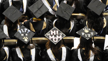 In a sea of mortarboards, biological sciences graduate Caitlin Timoney sends a message to her mother.