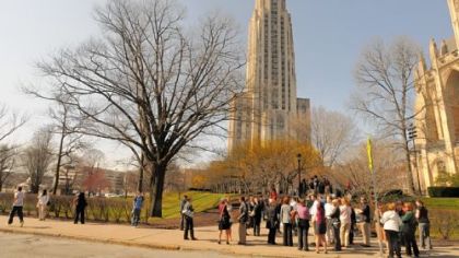 People wait along South Bellefield Avenue after being evacuated March 14 from the Cathedral of Learning at the University of Pittsburgh because of a bomb threat.