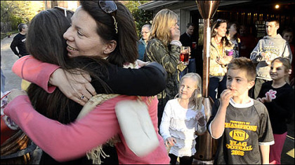 Friends and neighbors welcome home Chris Cieslak, who ended this month a one-year deployment to Afghanistan.
