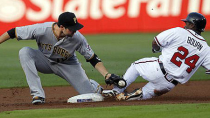 Atlanta Braves center fielder Michael Bourn is tagged out by  Pirates second baseman Neil Walker (18) as he attempts to steal second base in the first inning)