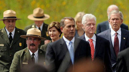 Former first lady Laura Bush walks behind Speaker of the House John Boehner with former president Bill Clinton and former president George Bush at the Flight 93 National Memorial Dedication on Sept. 10, 2011, in Stoneycreek Township near Shanksville, Somerset County.