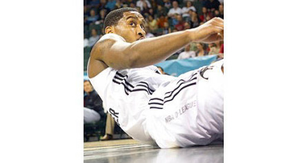 Brad Wanamaker picks himself up after getting hit on the way to the basket in the Toros' series vs. Erie.