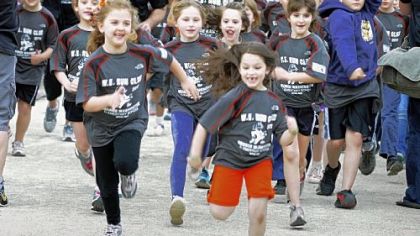 George Washington Elementary School students, kindergarden to 4th graders, begin a one mile training run on the Montour Trail near their school in Bethel Park. About 200 students ran, preparing for the Kids of STEEL, joining other schools' students who will run the Kids Marathon on Saturday as part of the Pittsburgh Marathon on Sunday.