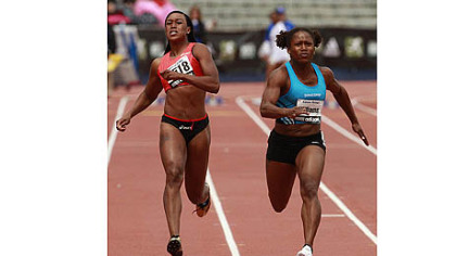 Lauryn Williams, right, gets past Stephanie Durst to win the women's 100-meter dash at the Kansas Relays last month in Lawrence, Kan.
