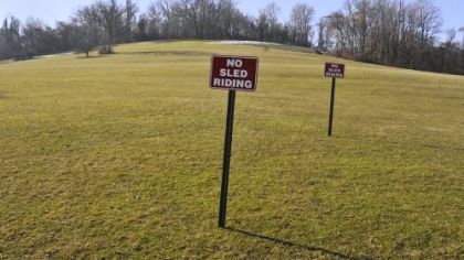 Even if there were anyone around at Boyce Park to heed the signs Feb. 6, there was almost no snow to be seen as the temperatures reached into the upper 40s.