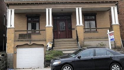 This four-bedroom brick house on Mount Washington is on the market for $195,000.