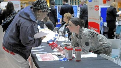 Sharone Frazier, a nursing student at Community College of Allegheny County, talks with National Guard recruiter Brittany Graeves at the job fair last Thursday at CCAC North campus.