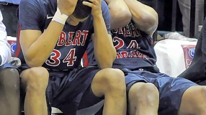 A dream denied, Robert Morris' Russell Johnson and Lawrence Bridges wait out the final seconds in Brooklyn.