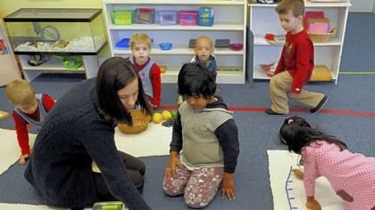 Teacher Sandra Kutchman works with students in her class at The Glen Montessori School in Emsworth.
