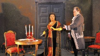 Tosca (Angela Brown) seizes an opportunity -- and a knife -- to end Scarpia's (Mark Delavan) tyranny in "Tosca."