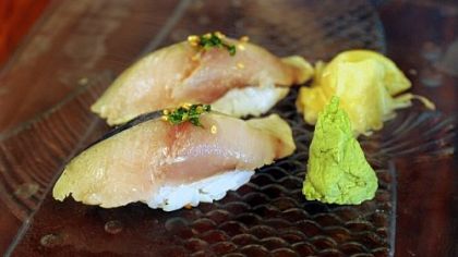 Spanish mackerel nigiri with pickled ginger and wasabi.