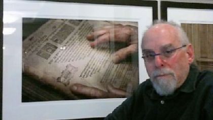 David Aschkenas with several of his photographs at Rodef Shalom in Shadyside.
