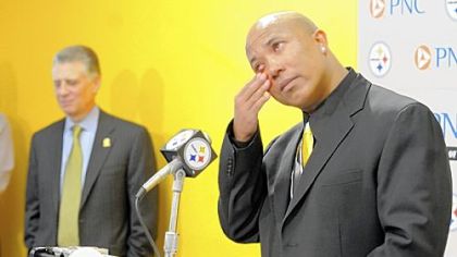 A tearful Hines Ward speaks at a press conference Tuesday at the Steelers offices on the South Side announcing his retirement from football. Steelers President Art Rooney stands in the background.