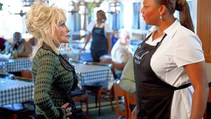 Dolly Parton, left, and Queen Latifah butt heads over the church choir in "Joyful Noise."