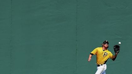 Nate McLouth makes a running catch during outfield drills Saturday in Bradenton, Fla.