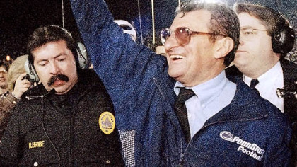 In this Jan. 2, 1995 file photo, Penn State head coach Joe Paterno smiles as he celebrates his team's victory over the University of Oregon in the Rose Bowl college game in Pasadena, Calif.