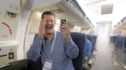 Eric Mueller captures a simulated emergency at American Airlines' Fort Worth, Texas, training facility during a fantasy field trip for aviation buffs sponsored in part by the airline.