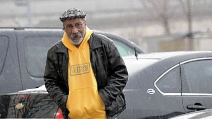 Richard McGee turns himself in at city police headquarters Wednesday.