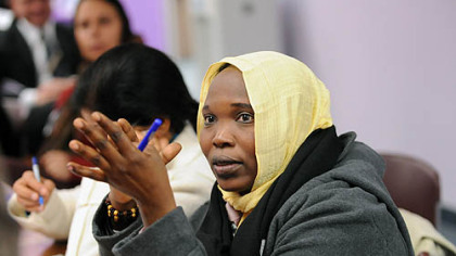 Hawa Abdallah Mohammed Salih, a human rights activist from Sudan, asks a question during a talk and reception for International Women of Courage awardees at Gwen's Girls in Point Breeze.
